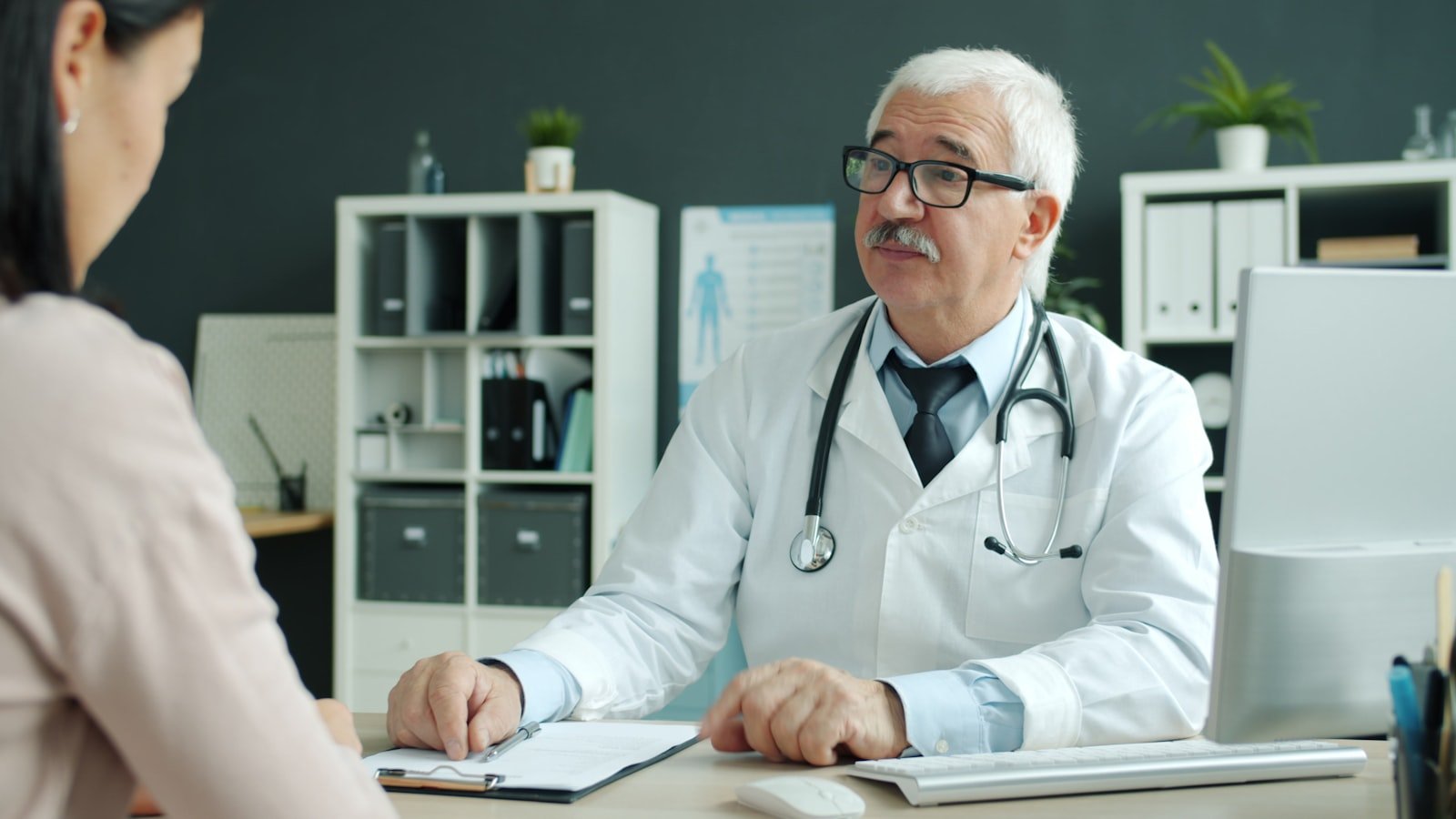 A clinician with a patient